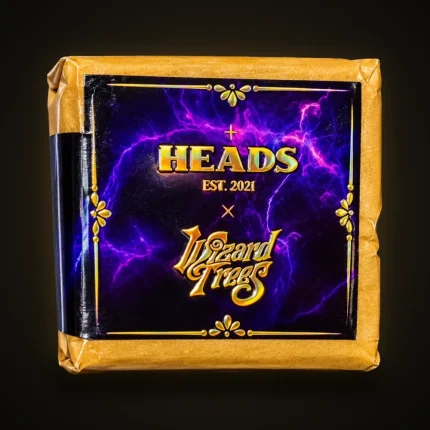 A paper-wrapped pack with the HEADS Est. 2021 x Wizard Trees purple lightning label
