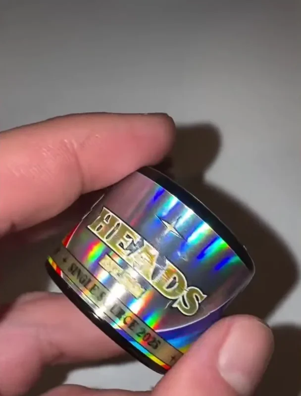 A holographic HEADS jar marked single source 2025